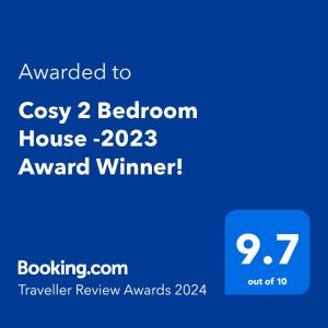 拉姆斯盖特Cosy 2 Bedroom House -2022 & 2023 Award Winner!的给cosasy卧室房子gmaxwell的文本的手机的屏幕