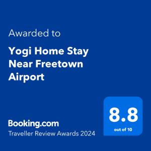 弗里敦Yogi Home Stay Near Freetown Airport的手机的屏幕照相,手机文本被授予了Yog家居的频率