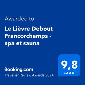 弗朗科尔尚Le Lièvre Debout Francorchamps - spa et sauna的手机的屏幕,短信被授予Le league折扣安排Spa