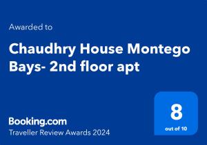 蒙特哥贝Chaudhry House Montego Bays- 2nd floor apt的蓝色的标志,上面写着霍菲尼房子摩洛科买地板