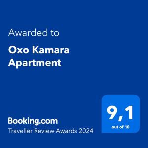 卡尔帕索斯Oxo Kamara Apartment的蓝色文本框,上面有授予牛的业力任命的词