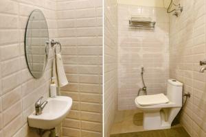 新德里FabExpress Seven Heaven的一间带水槽、卫生间和镜子的浴室
