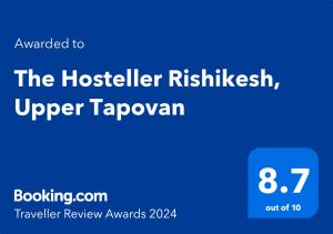瑞诗凯诗The Hosteller Rishikesh, Upper Tapovan的手机的屏幕,带旅舍的挂毯