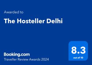 新德里The Hosteller Delhi的手机的屏幕,带有文字升级到旅舍的Delhi