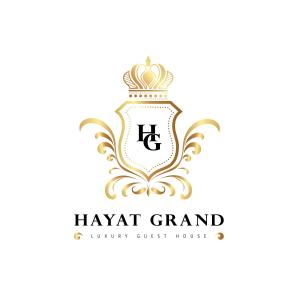 伊斯兰堡Hayat Grand Guest House Islamabad的带有皇冠的古老英雄标志