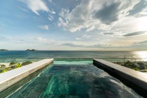 里约热内卢Lifestyle Laghetto Collection的海景游泳池