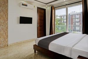 Collection O Vikrant Residency客房内的一张或多张床位