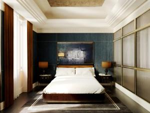 罗马拜伦勋爵酒店 - 世界小型豪华酒店集团的一间卧室配有一张床和两张带台灯的桌子。