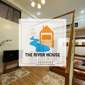美岸The River House - Loft Units的河房的标志,房间舒适旅馆
