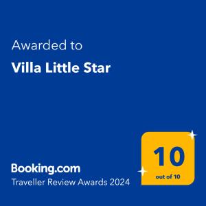 普拉亚布兰卡Villa Little Star的黄色的标语,表示授予香草小星