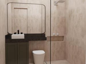 奥林达Duplex的一间带卫生间、水槽和镜子的浴室