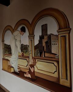 特伦托Residence Al Castello的一张有孩子的床上男人的画