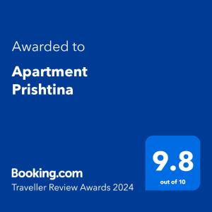 普里什蒂纳Apartment Prishtina的蓝电话屏幕,文字被授予任命的皮蒂娜