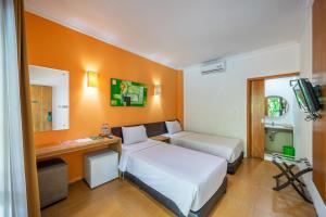 斯巴泽欧巴厘岛酒店客房内的一张或多张床位
