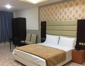 OYO Al Taj Rest House客房内的一张或多张床位