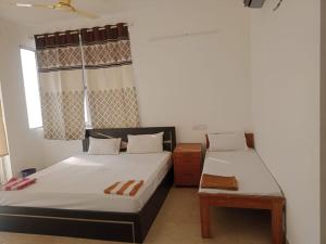 Suman beach House客房内的一张或多张床位