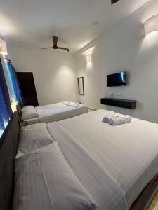 La Tamara Auroville客房内的一张或多张床位