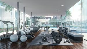 阿布扎比Silk Valley - Furnished Studio With Pool And Gym的大楼内带跑步机和健身器材的健身房