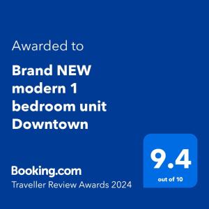 迈阿密Brand NEW modern 1 bedroom unit Downtown的带有文本的手机的屏幕照,以全新的现代棕色单元