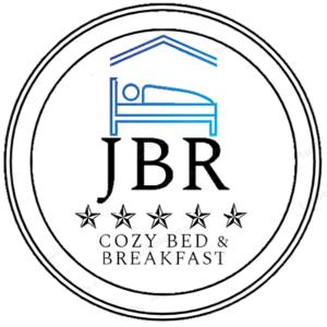 宿务JBR Cozy Bed & Breakfast的住宿加早餐旅馆的标志