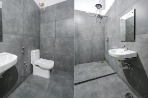 Haidar SāhibgūdaFabHotel Skycity的一间带水槽、卫生间和镜子的浴室