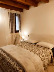 Ca' degli Sposi客房内的一张或多张床位