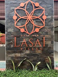 吉利阿尔Lasai Villas的进入拉萨塔尔村的标志