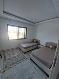 The Wave residence Chott Meriam Sousse客房内的一张或多张床位