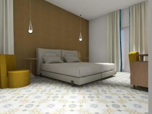 斯卡拉帕斯卡尔宫酒店的一间卧室配有一张床和两张黄色椅子
