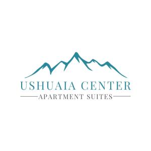 乌斯怀亚Ushuaia Center Apartament Suit的一座以山为背景的会议中心的标志