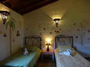 拉嘉斯托萨卡萨乡间酒店客房内的一张或多张床位