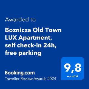 波兹南Boznicza Old Town LUX Apartment, self check-in 24h, free parking的一部手机的屏幕,上面有文字要写成博南扎老城区的uk