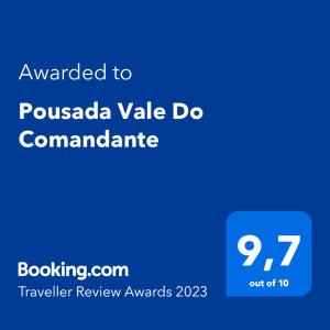 马卡科斯Pousada Vale Do Comandante的蓝色的屏幕,文字被授予Pussada vale doommant
