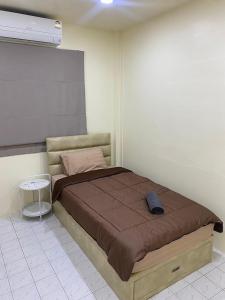 Bang HiaMee-Suk Home的卧室配有一张床