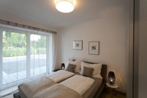 格拉茨公园套房公寓客房内的一张或多张床位
