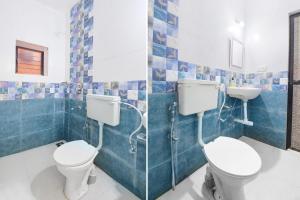 巴加FabExpress Shanel Beachside Resort的浴室设有2个卫生间和水槽