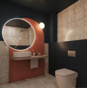 巴塞罗那费拉欧尼斯酒店的一间带卫生间和圆镜子的浴室