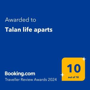 阿特劳Talan life aparts的黄色标志,文字被授予塔利亚生命物剂