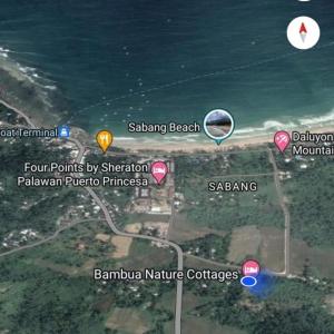 公主港Bambua Nature Cottages的一张带有粉红色点和海洋的海滩地图