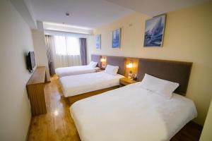 Hi Inn Nanjing Hunan Road Wuyue Plaza客房内的一张或多张床位