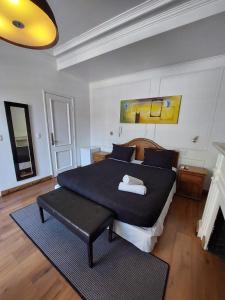 Hotel Santiago Patio Bellavista客房内的一张或多张床位