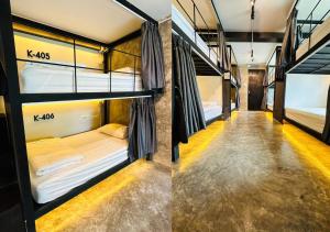 清迈Adora Hostel的走廊的客房内设有两张双层床。