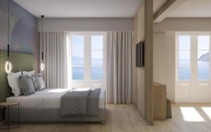 锡米Nireus Hotel的一间卧室设有一张床,享有海景