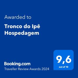 戈亚斯州上帕莱索Tronco do Ipê Hospedagem的蓝色的屏,文字翻译成troma做iprec的脊椎动物学家