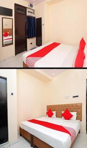 勒克瑙Hotel moon place的一间卧室配有两张带红色枕头的床