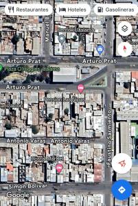 卡拉马Hostal Las Ñipas的城市地图,有建筑和街道标志