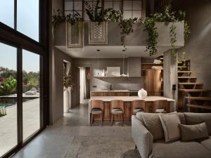 普莱诺斯Theros Exotica Loft Villa Contemporary 2BR W pool in Tsilivi Hills的开放式厨房以及带桌椅的客厅。