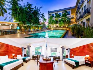 暹粒绿色亚马逊公寓酒店的酒店客房带两张床和一个游泳池