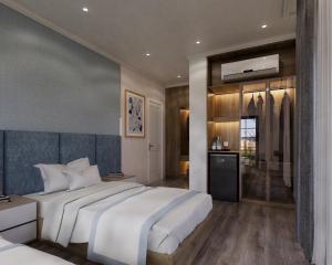 后川Wonderland Villa Hồ Tràm Beach的一间带白色大床的卧室和一间浴室