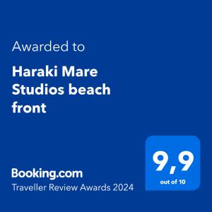 哈拉奇Haraki Mare Studios beach front的一部电话的屏幕,上面有文字要用来在海滩前进行骚扰研究